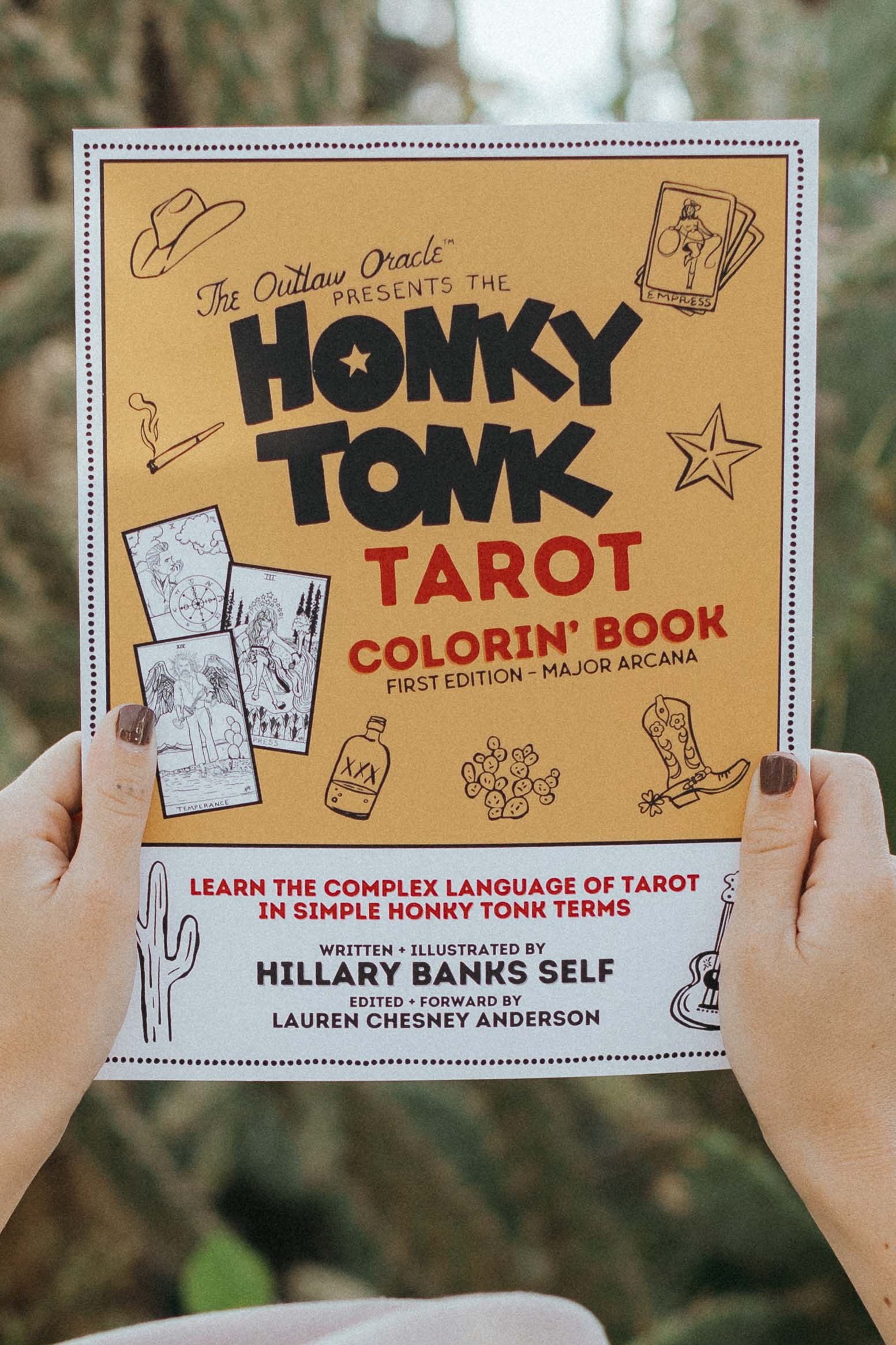Honky Tonk Tarot Coloring Book cover showing soft-touch finish and outlaw artwork