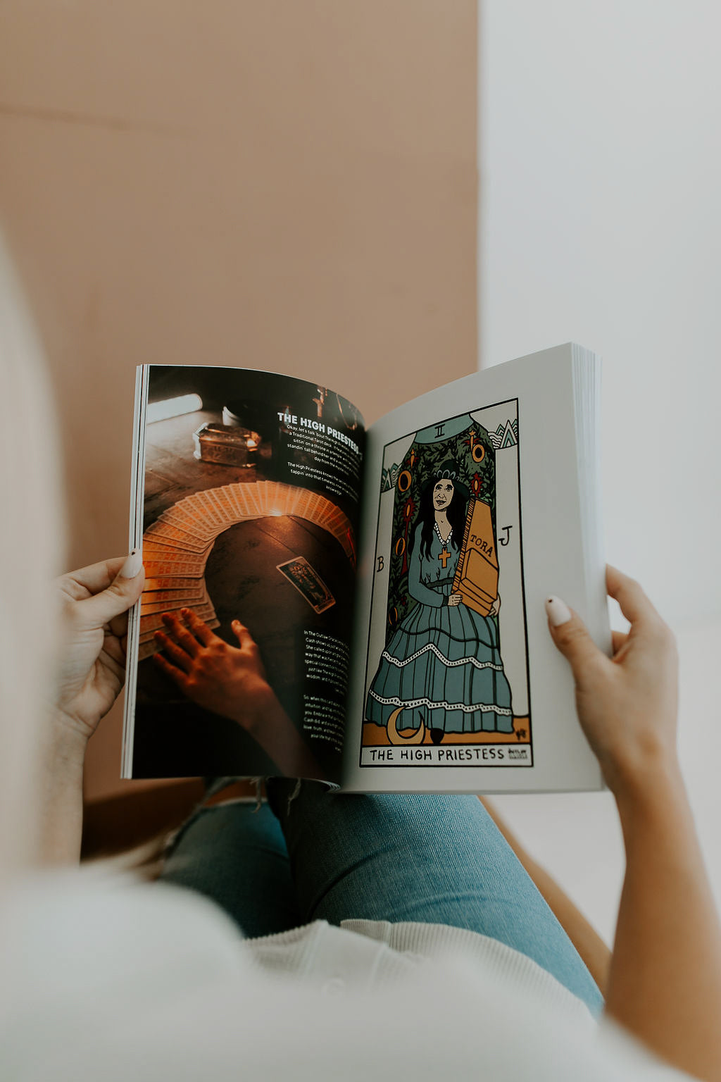 This 141-page Honky Tonk Tarot Coloring Book Features premium paper quality, full-color images and lessons - as well as full-sized black and white coloring pages of each Major Arcana card. In this photo you see The High Priestess, who is compared to June Carter Cash in The Honky Tonk Tarot.