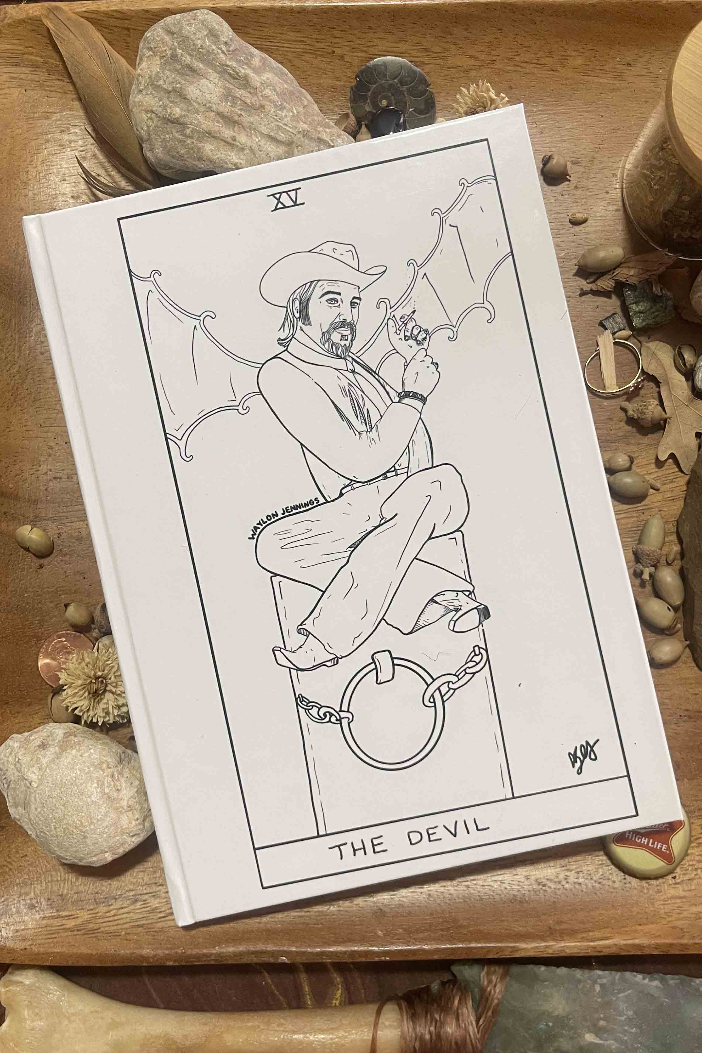 Western-style hardcover journal featuring Waylon Jennings Devil tarot artwork and Willie Nelson Judgment design. Blank Pages to capture all your wildest stories and songs.  From The Outlaw Oracle's Honky Tonk Tarot Collection.