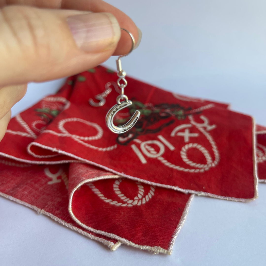 Tibetan silver horseshoe earrings demonstrating natural swing and movement